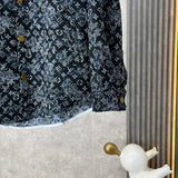 Back view of Louis Vuitton luxury clothing with label-forward styling