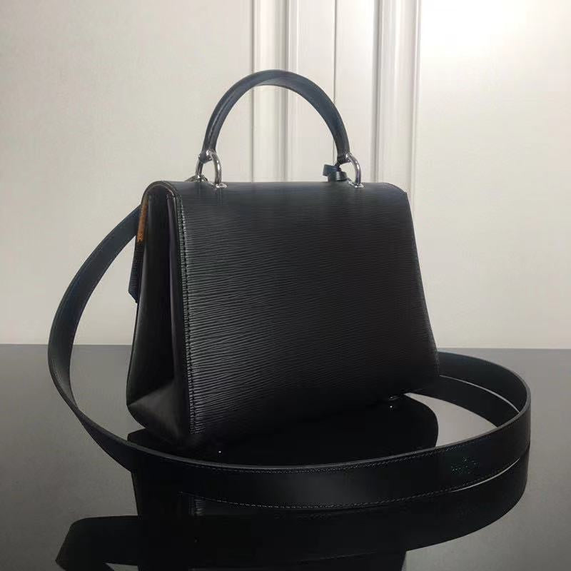 Styled lifestyle shot of polished elevated women's handbag – women's premium purse