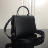 Styled lifestyle shot of polished elevated women's handbag – women's premium purse