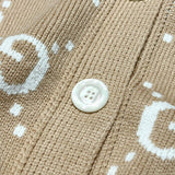 Full styled look of Gucci luxury clothing with monogram-inspired silhouette