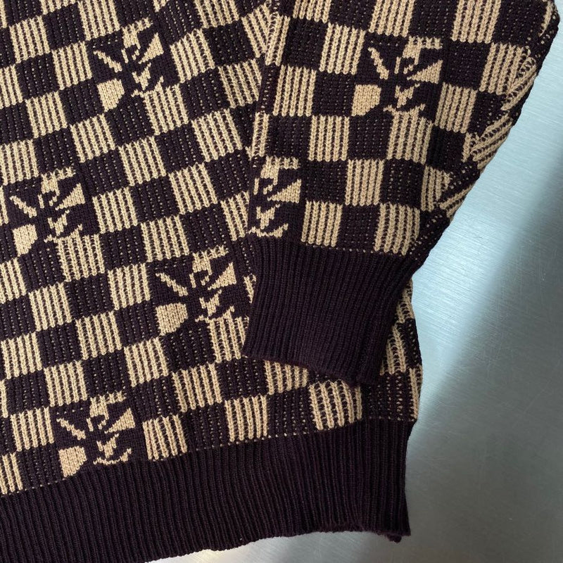 Close-up detail shot of Louis Vuitton luxury clothing with monogram-inspired silhouette