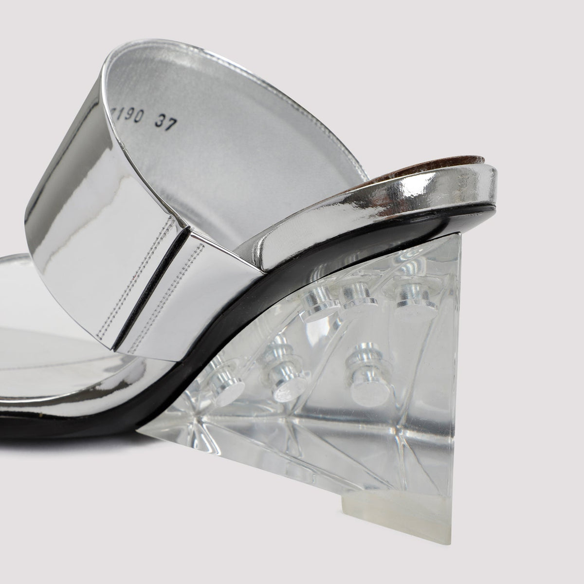 Close-up of Alexander McQueen slides hardware and fine stitching