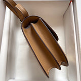 Side view of classic structured handbag