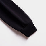 Back view of Louis Vuitton luxury clothing with label-forward styling