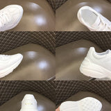 Side profile of Gucci bold contrast sneakers signature lace-up style