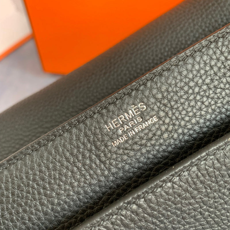 Side view of sleek structured handbag