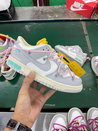 Nike Designer sneakers in crisp white retro runner design front view