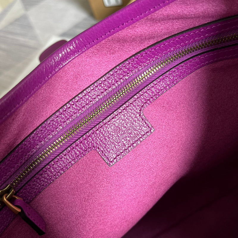 Side view of sculpted structured handbag