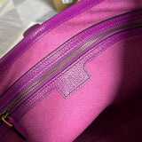 Side view of sculpted structured handbag