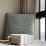  polished top-handle bag styled with outfit