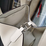  Sleek structured bag carried on shoulder 22