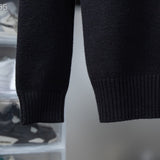 Close-up detail shot of Louis Vuitton luxury clothing with signature branding