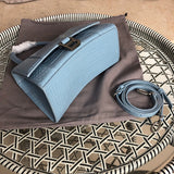 Back view of polished classic women's handbag – women's luxury accessory