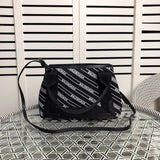 Front view of chic polished women's handbag – women's luxury handbag