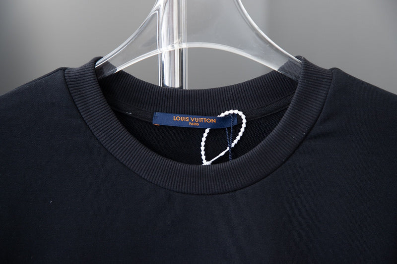 Close-up detail shot of Louis Vuitton luxury clothing with relaxed-fit cut