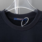 Close-up detail shot of Louis Vuitton luxury clothing with relaxed-fit cut