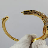 Side view of Cartier unisex jewelry piece