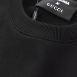 Close-up detail shot of Gucci luxury clothing with signature branding