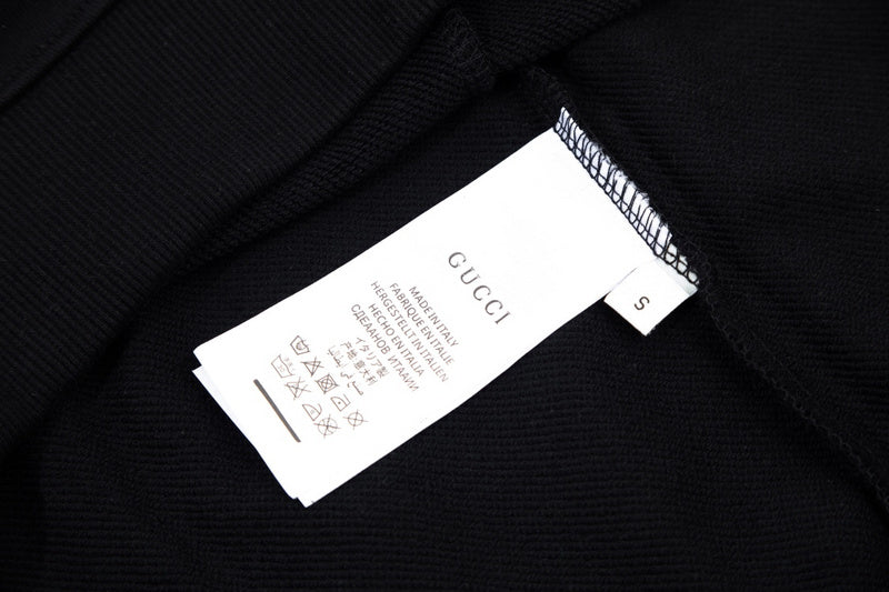 Close-up detail shot of Gucci luxury clothing with tailored silhouette