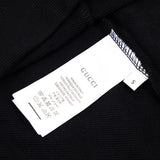 Close-up detail shot of Gucci luxury clothing with tailored silhouette