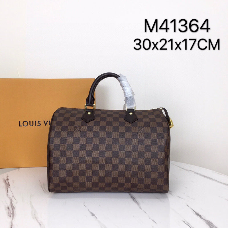 Side profile of classic polished women's handbag – women's luxury handbag