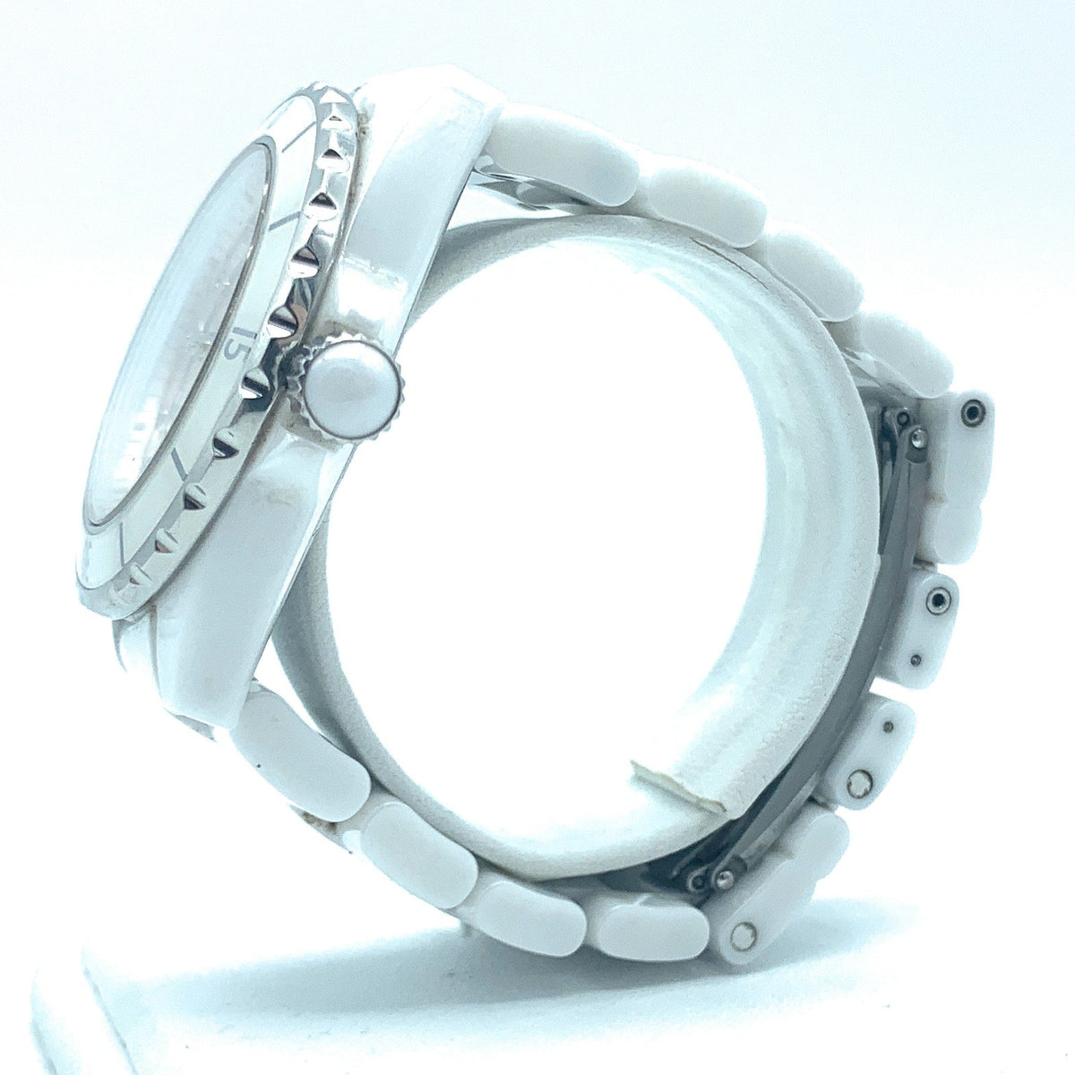 Close-up detail view of Chanel unisex white watch