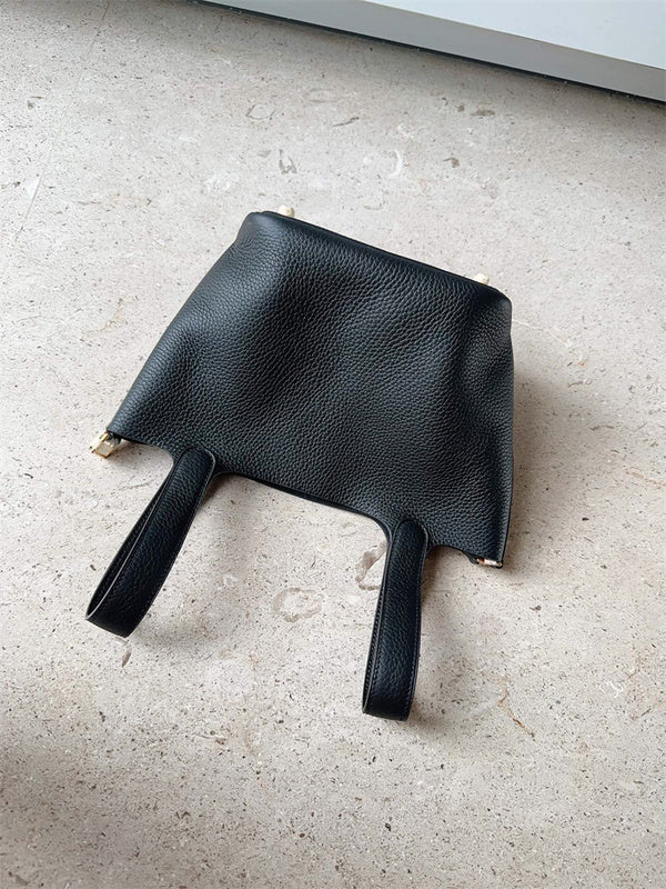  Structured crossbody bag carried on shoulder 22
