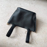  Structured crossbody bag carried on shoulder 22