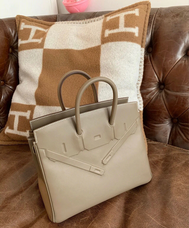 Side view of minimalist structured handbag