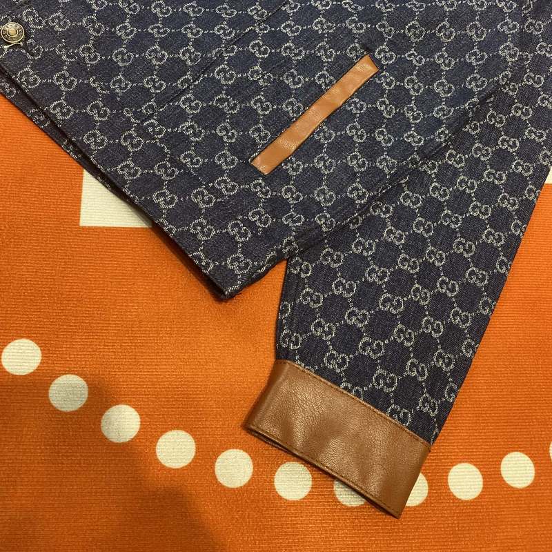 Flat lay presentation of Gucci luxury clothing with logo-detail design