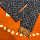 Flat lay presentation of Gucci luxury clothing with logo-detail design