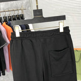 Back view of Rhude luxury clothing with logo-detail design
