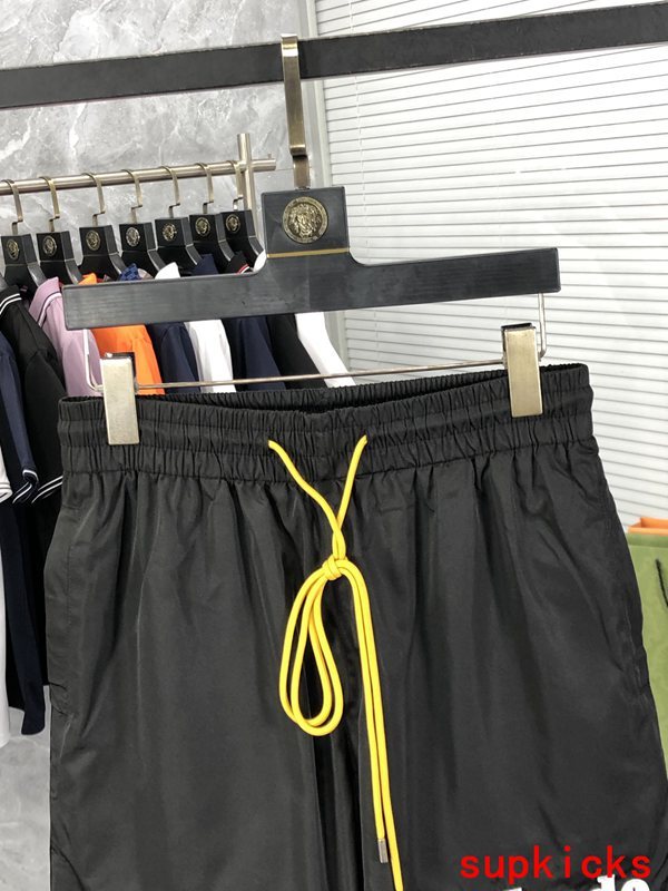 Close-up detail shot of Rhude luxury clothing with label-forward styling