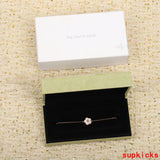 Side view of Van Cleef & Arpels unisex jewelry piece