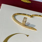 Side view of Cartier unisex jewelry piece
