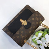 Side profile of statement refined women's handbag – women's designer-style accessory
