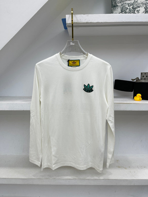 Close-up detail shot of Gucci luxury clothing with logo-detail design