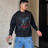 Flat lay presentation of Louis Vuitton luxury clothing with streetwear-inspired cut