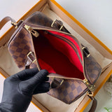 Handle and strap detail of polished signature women's handbag – women's luxury handbag