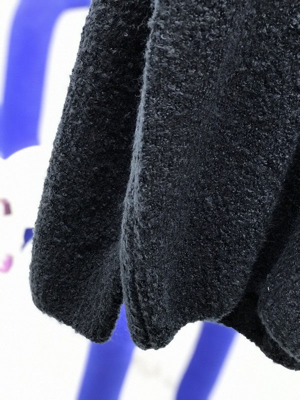 Close-up detail shot of Louis Vuitton luxury clothing with label-forward styling