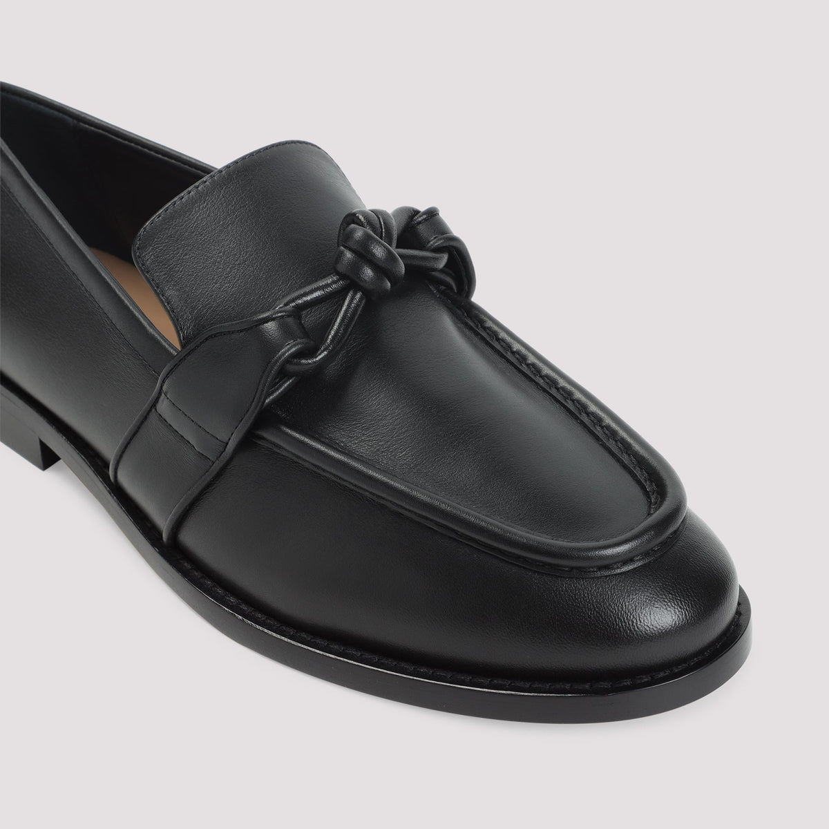 Close-up of Bottega Veneta athletic hardware and fine stitching