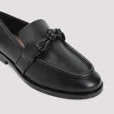 Close-up of Bottega Veneta athletic hardware and fine stitching