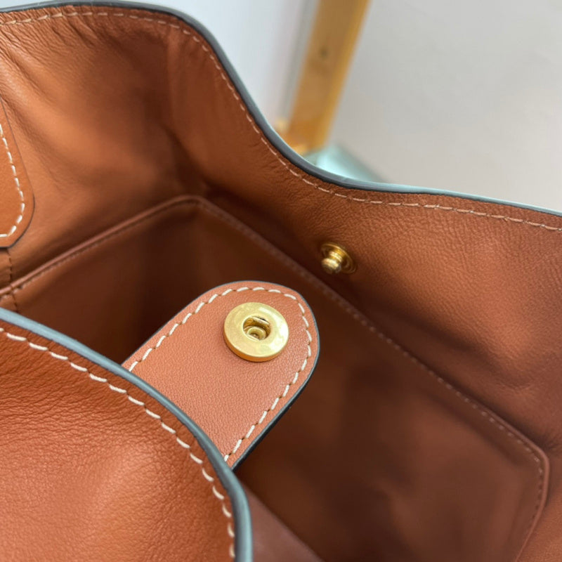 Close-up detail of structured signature women's handbag – women's designer-style accessory