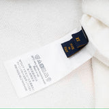 Close-up detail shot of Louis Vuitton luxury clothing with contemporary cut