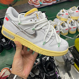 Side profile of Nike two-tone sneakers streetwear statement look