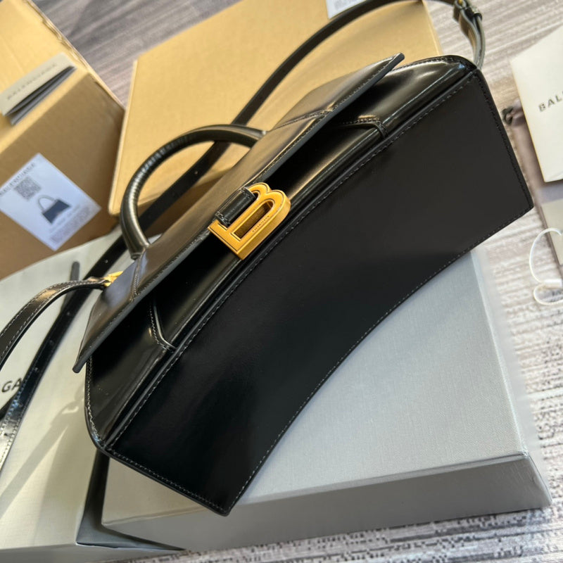 Styled lifestyle shot of sleek classic women's handbag – women's designer-style accessory