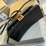 Styled lifestyle shot of sleek classic women's handbag – women's designer-style accessory