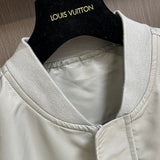 Close-up detail shot of Louis Vuitton luxury clothing with label-forward styling
