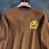 Full styled look of Louis Vuitton luxury clothing with monogram-inspired silhouette