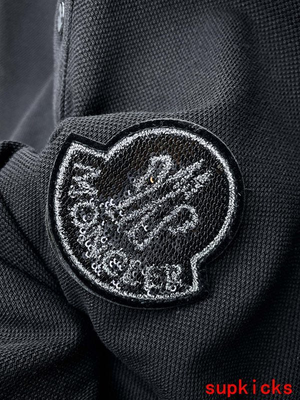 Front view of Moncler luxury clothing with logo-detail design